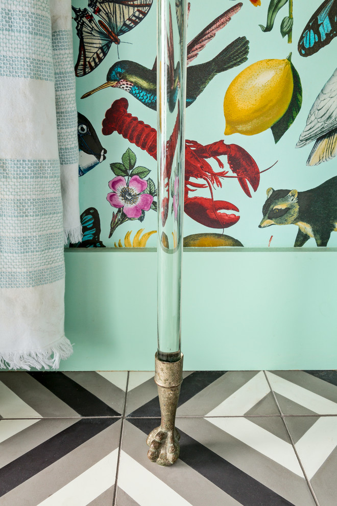 Inspiration for a small eclectic cloakroom in Los Angeles with raised-panel cabinets, turquoise cabinets, a two-piece toilet, cement flooring, a submerged sink, marble worktops and black floors.