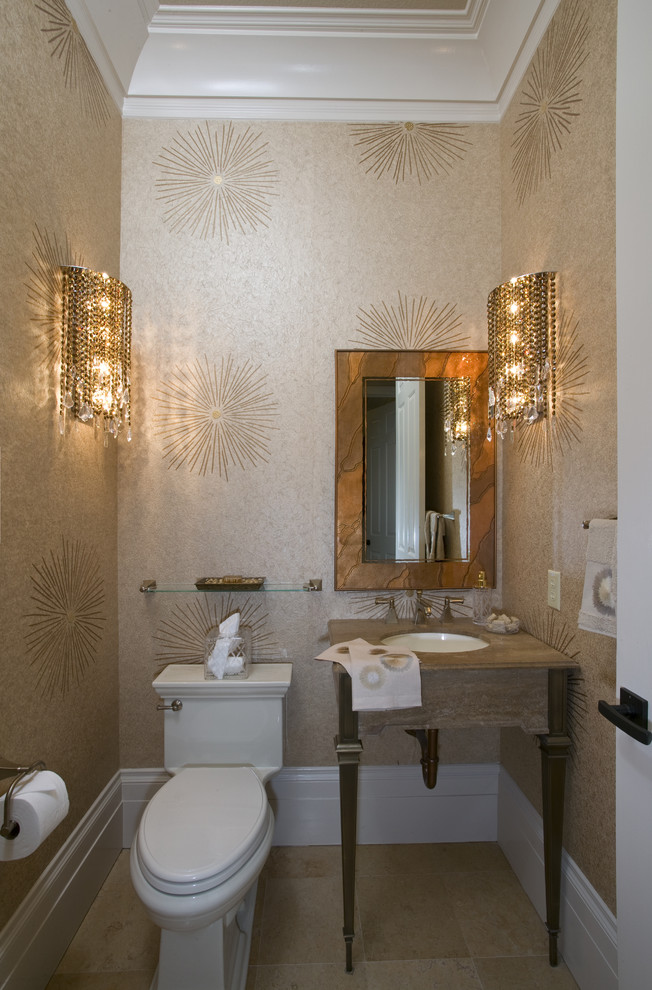 Photo of a small contemporary cloakroom in Sacramento with a submerged sink, beige walls, travertine flooring, a one-piece toilet, freestanding cabinets, marble worktops, beige floors and beige worktops.