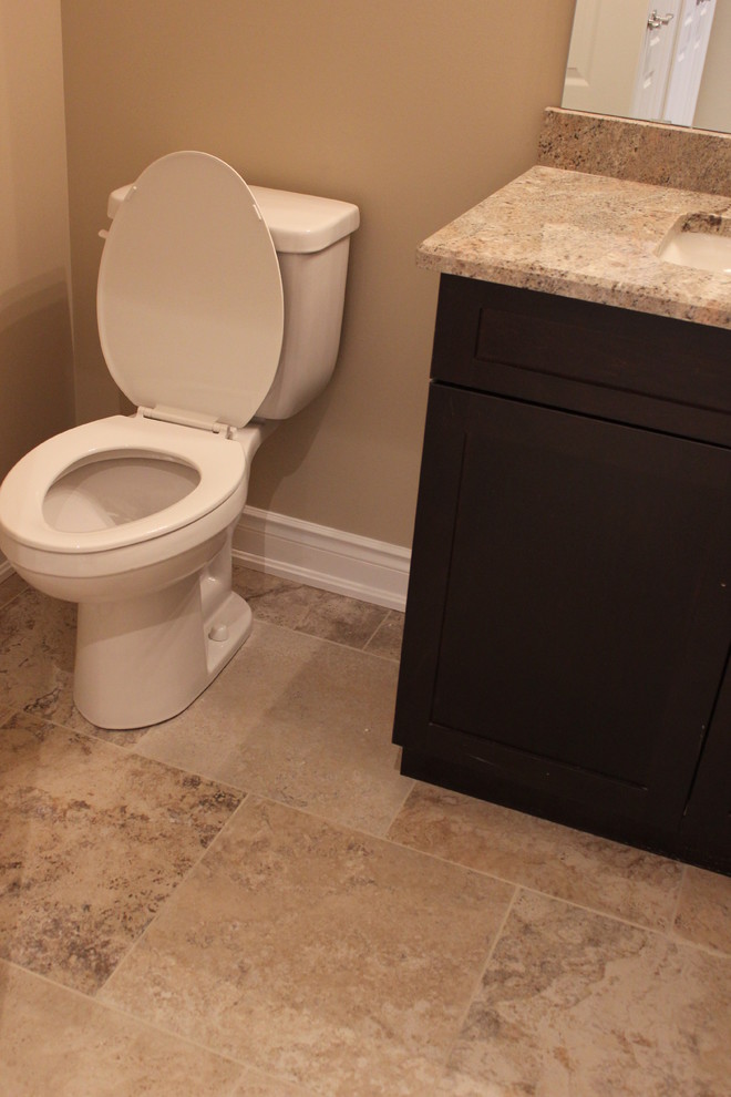 This is an example of a traditional cloakroom in Toronto with multi-coloured tiles, porcelain tiles, beige walls, porcelain flooring, shaker cabinets and dark wood cabinets.