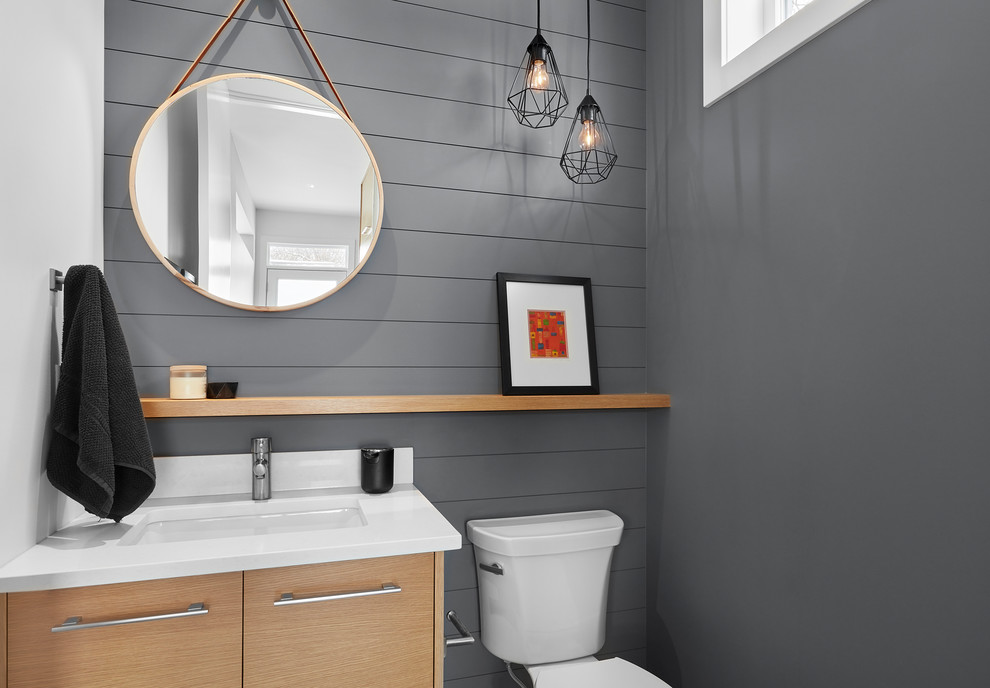 Example of a trendy powder room design in Edmonton with flat-panel cabinets, light wood cabinets, gray walls, an undermount sink and quartz countertops
