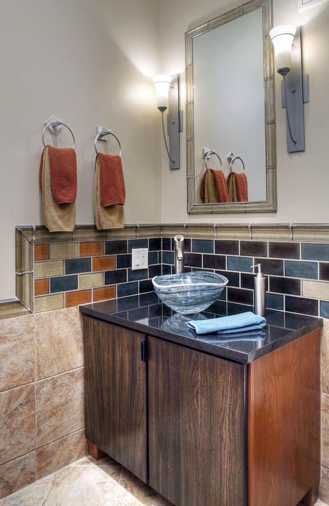 Small contemporary cloakroom in Omaha with flat-panel cabinets, brown cabinets, beige tiles, blue tiles, orange tiles, porcelain tiles, beige walls, porcelain flooring, a vessel sink, granite worktops, beige floors and grey worktops.