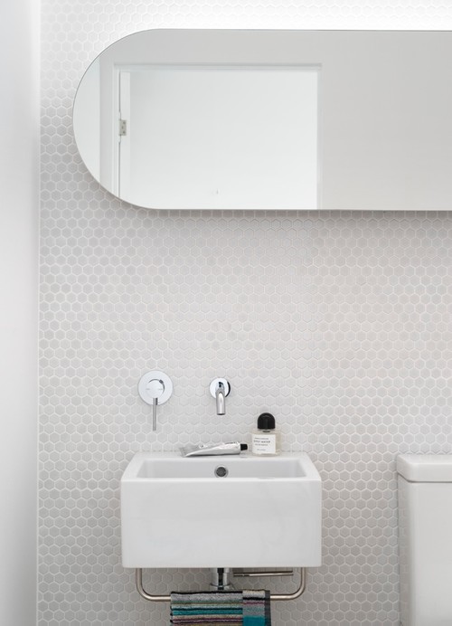 Gray Elegance: Gray Penny Tile Bathroom Backsplash with Frameless Mirror