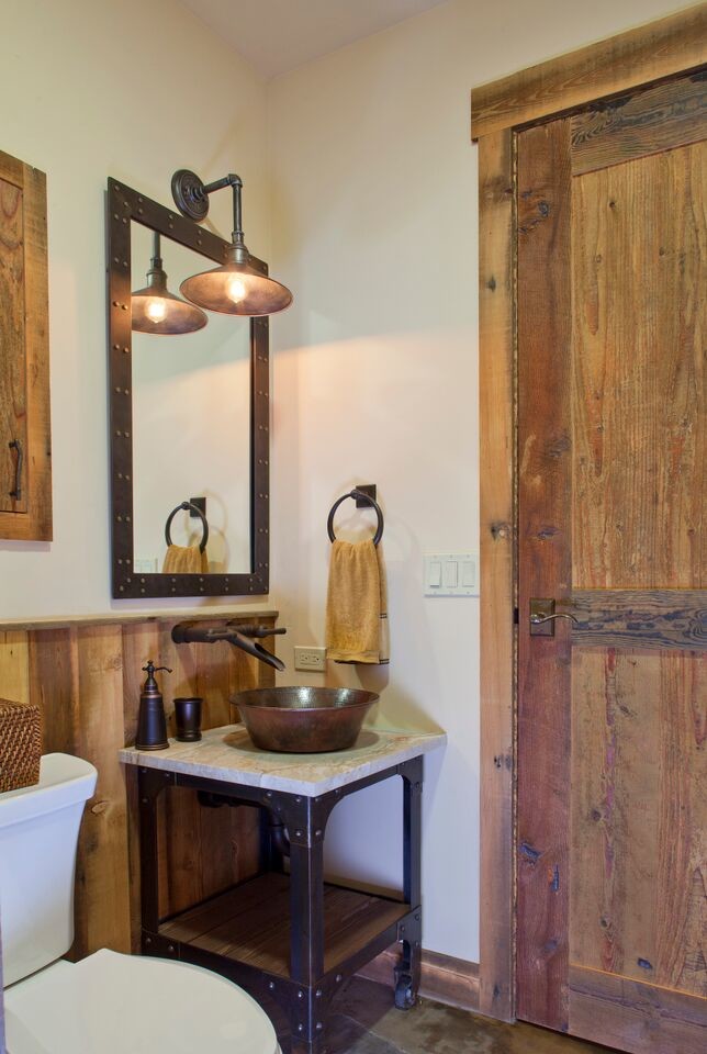 Powder room - mid-sized rustic slate floor powder room idea in Denver with shaker cabinets, medium tone wood cabinets, a two-piece toilet, white walls, a vessel sink and marble countertops