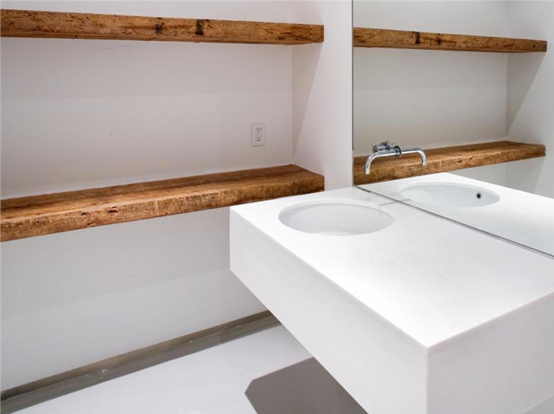 Small minimalist white floor powder room photo in New York with white walls, an integrated sink and quartz countertops