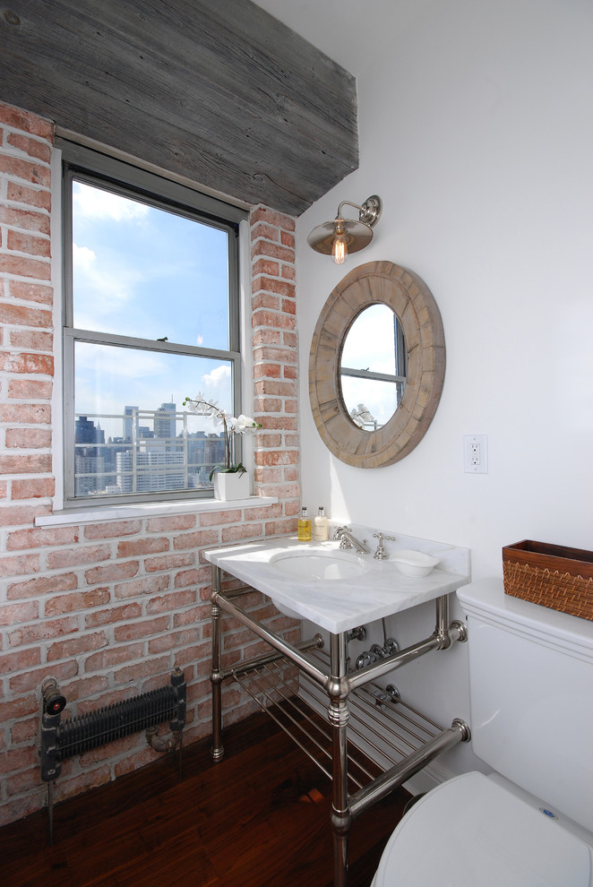 Photo of an urban cloakroom in New York with a console sink.