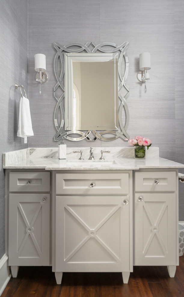 This is an example of a medium sized contemporary cloakroom in Houston with recessed-panel cabinets, white cabinets, grey walls, dark hardwood flooring, a submerged sink, quartz worktops, brown floors and white worktops.