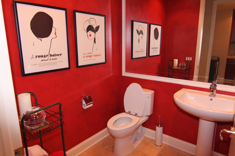 Mid-sized trendy porcelain tile and beige floor powder room photo in San Diego with a pedestal sink, a two-piece toilet, open cabinets, red walls and quartz countertops