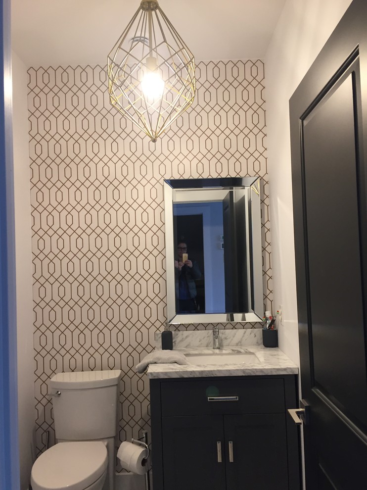 Inspiration for a medium sized classic cloakroom in Montreal with shaker cabinets, black cabinets, a two-piece toilet, white tiles, white walls, marble flooring, a submerged sink, marble worktops, grey floors and white worktops.