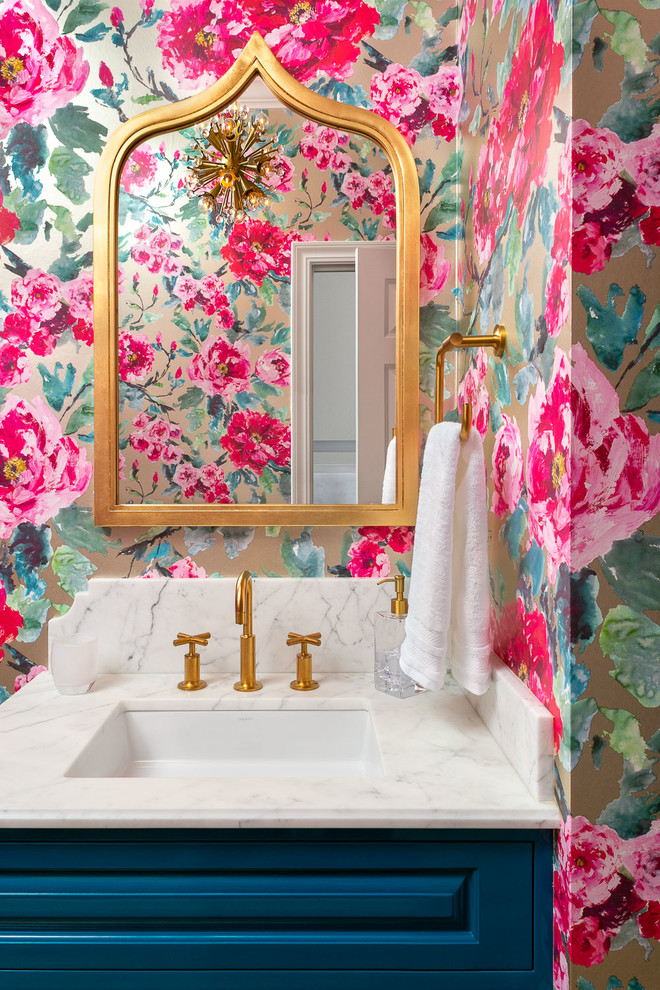 Transitional powder room photo in San Francisco with raised-panel cabinets, blue cabinets, multicolored walls, an undermount sink and white countertops