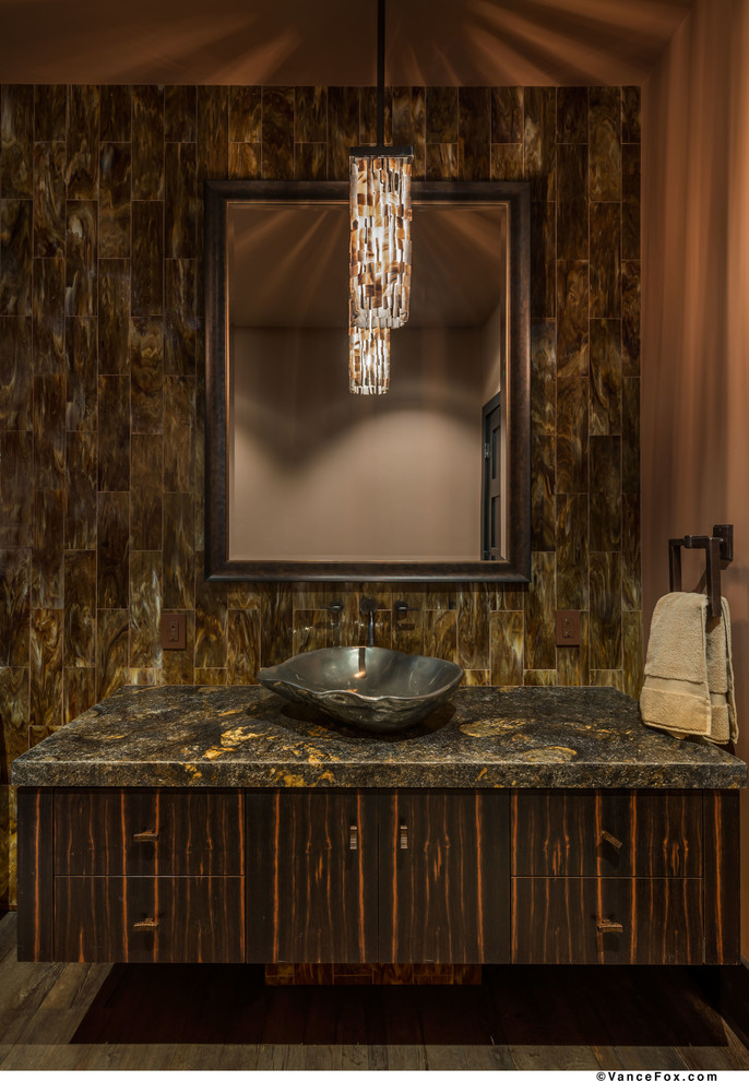 Powder room - small contemporary brown tile powder room idea in Sacramento with a vessel sink, flat-panel cabinets, dark wood cabinets, granite countertops and brown walls