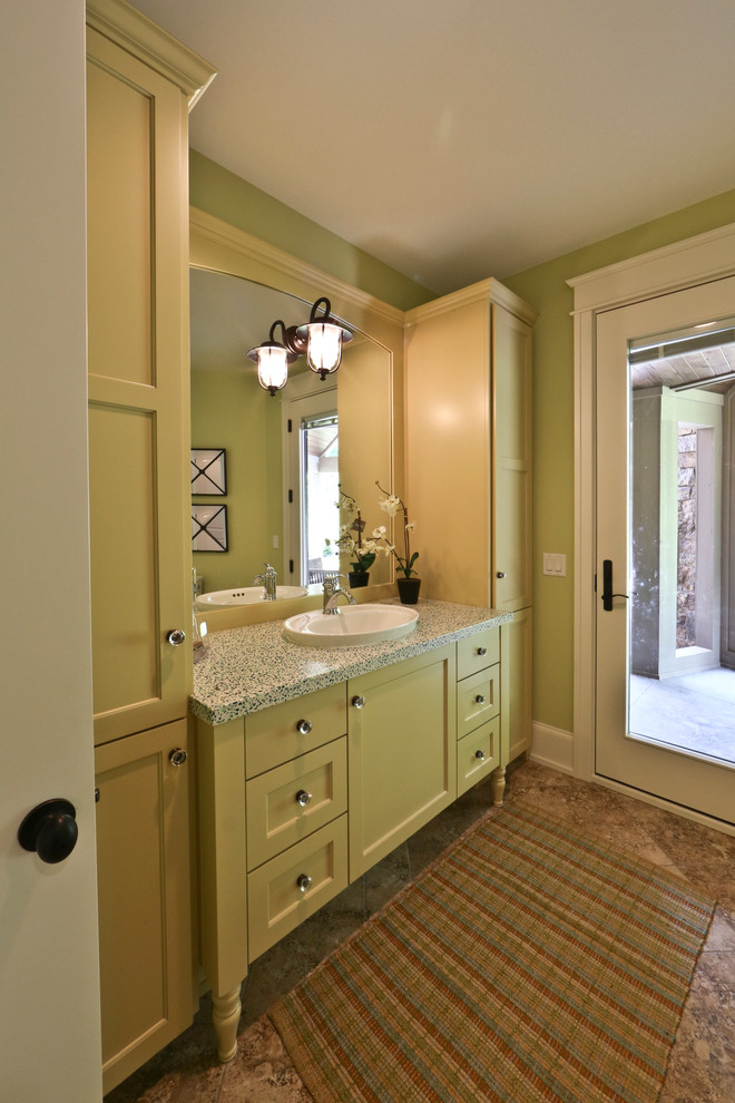 Design ideas for a large traditional cloakroom in Grand Rapids with recessed-panel cabinets, green cabinets, grey walls, marble flooring, a built-in sink and solid surface worktops.