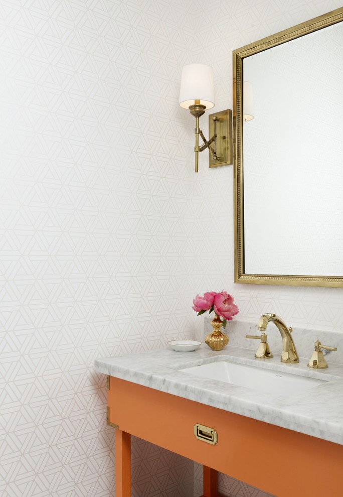Elegant powder room photo in Houston with multicolored walls, orange cabinets and gray countertops