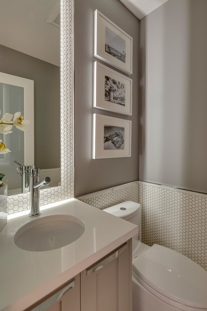 Inspiration for a small classic cloakroom in Vancouver with recessed-panel cabinets, quartz worktops, a one-piece toilet, white tiles, grey walls, mosaic tiles, grey cabinets and a submerged sink.
