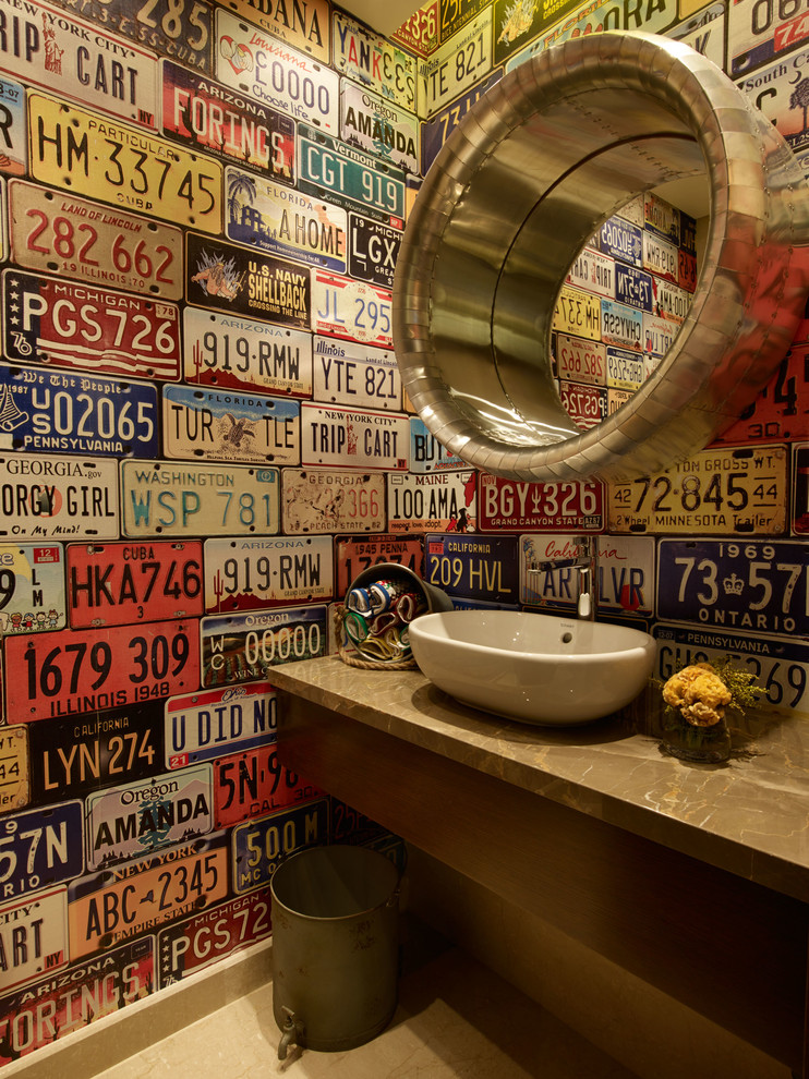 Eclectic powder room photo in Other with a vessel sink, flat-panel cabinets, dark wood cabinets, multicolored walls and brown countertops
