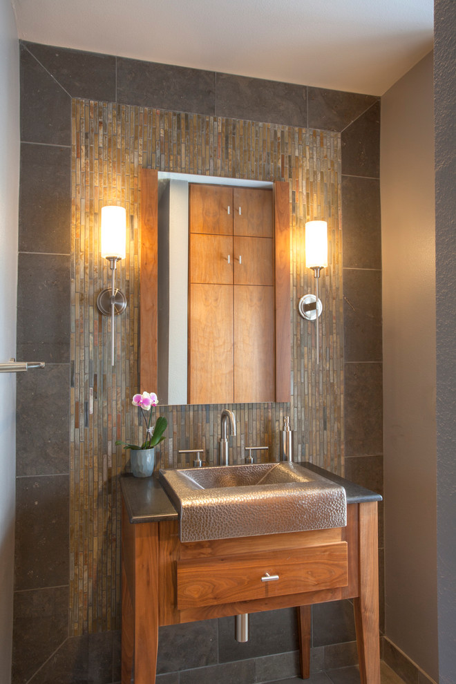 Design ideas for a medium sized rustic cloakroom in San Diego with freestanding cabinets, medium wood cabinets, grey tiles, grey walls, limestone flooring, slate tiles, a trough sink, marble worktops and beige floors.