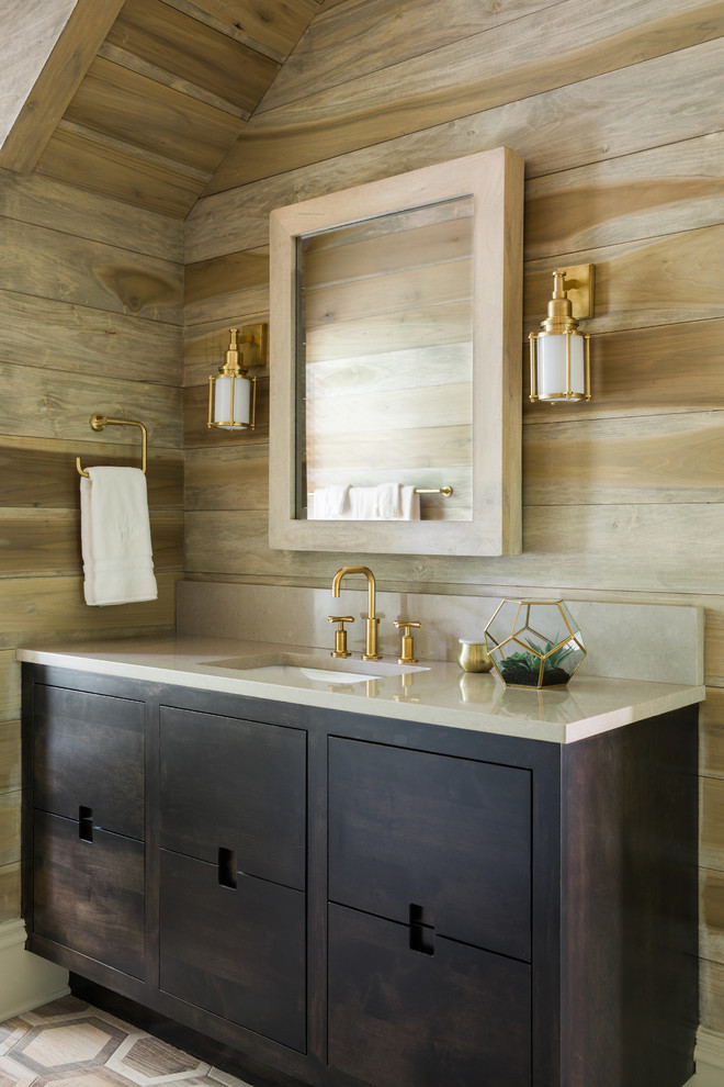 Inspiration for a coastal cloakroom in Atlanta with dark wood cabinets and a submerged sink.