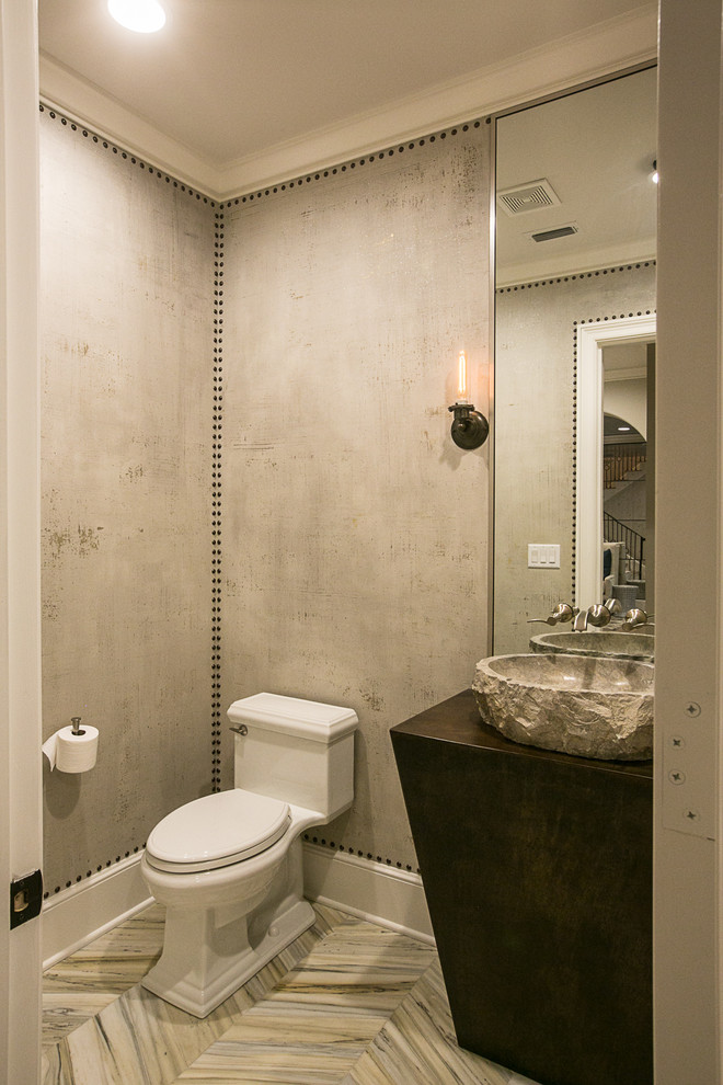 Powder room - transitional powder room idea in New Orleans with a vessel sink and gray walls