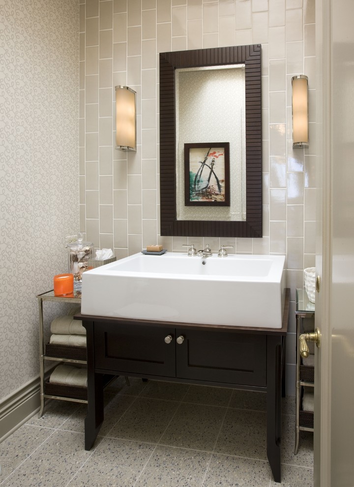 Example of a mid-sized eclectic subway tile and gray tile powder room design in Chicago with recessed-panel cabinets, dark wood cabinets and beige walls