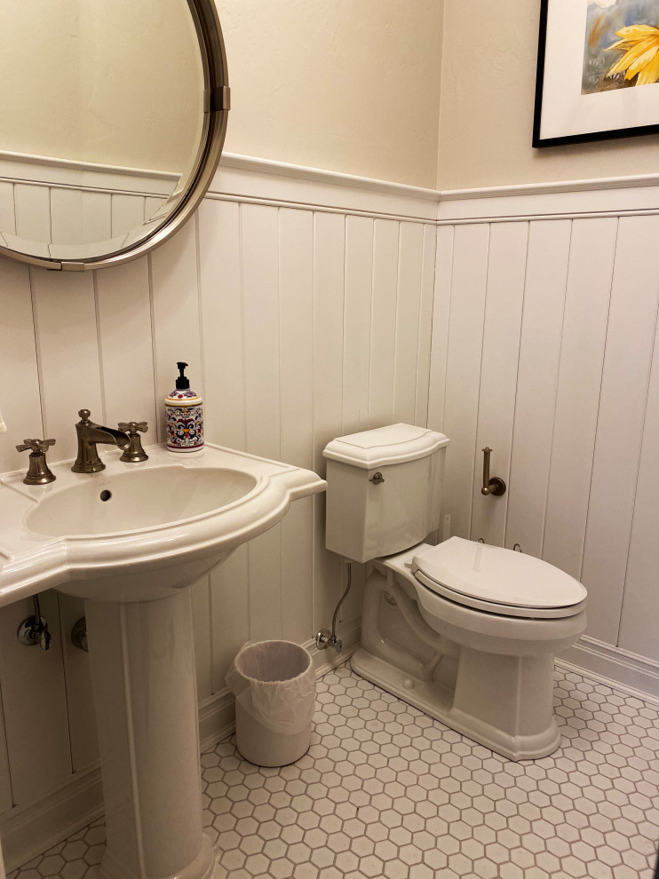 Design ideas for an expansive classic cloakroom in Milwaukee with recessed-panel cabinets, brown cabinets, a two-piece toilet, grey walls, mosaic tile flooring, a pedestal sink, engineered stone worktops, white floors, grey worktops, a built in vanity unit, a wood ceiling and panelled walls.