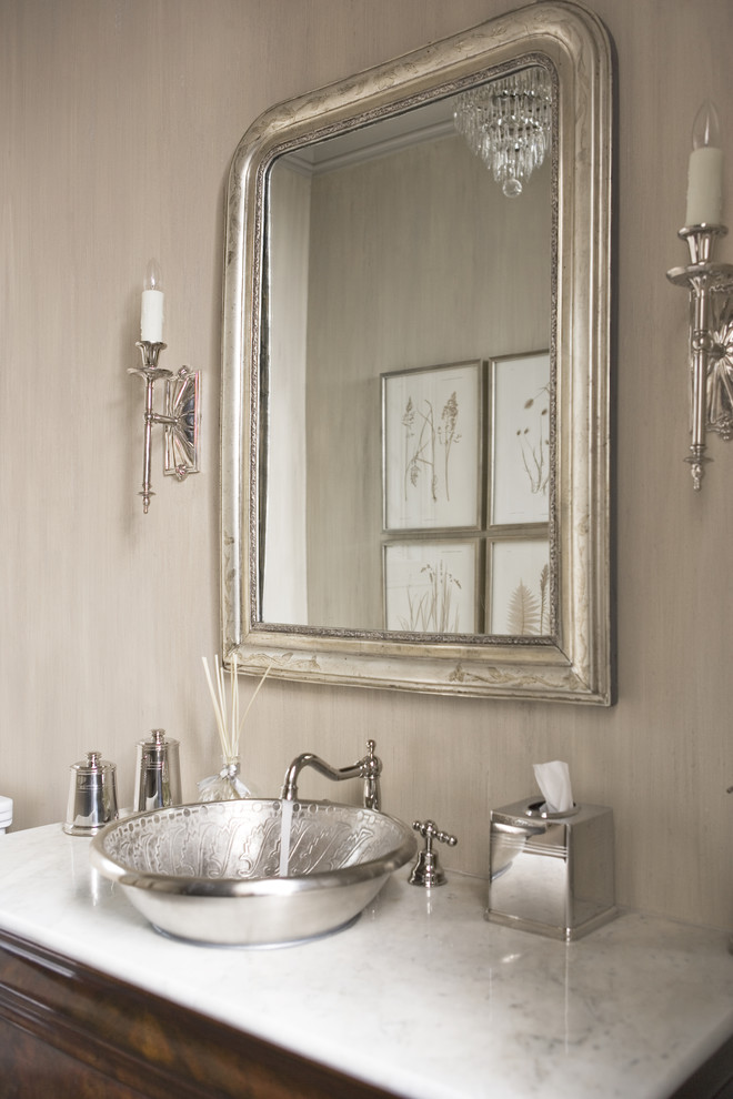 Example of a large transitional powder room design in Other with a vessel sink, marble countertops, beige walls and white countertops