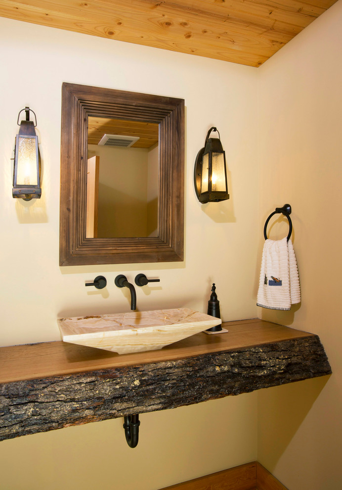Inspiration for a rustic cloakroom in DC Metro with a vessel sink, wooden worktops, beige walls and brown worktops.