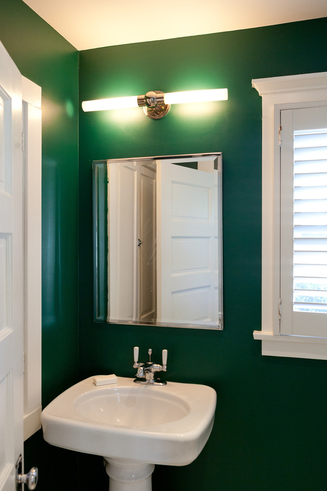 Inspiration for a large timeless powder room remodel in Los Angeles with green walls