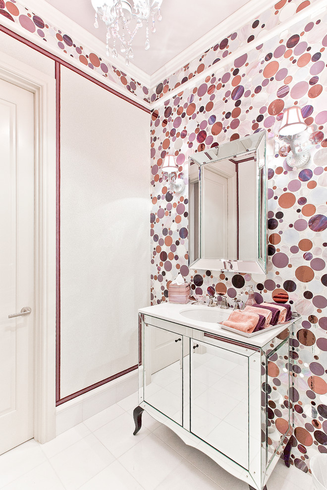 Immagine di un bagno di servizio design con lavabo sottopiano e ante lisce