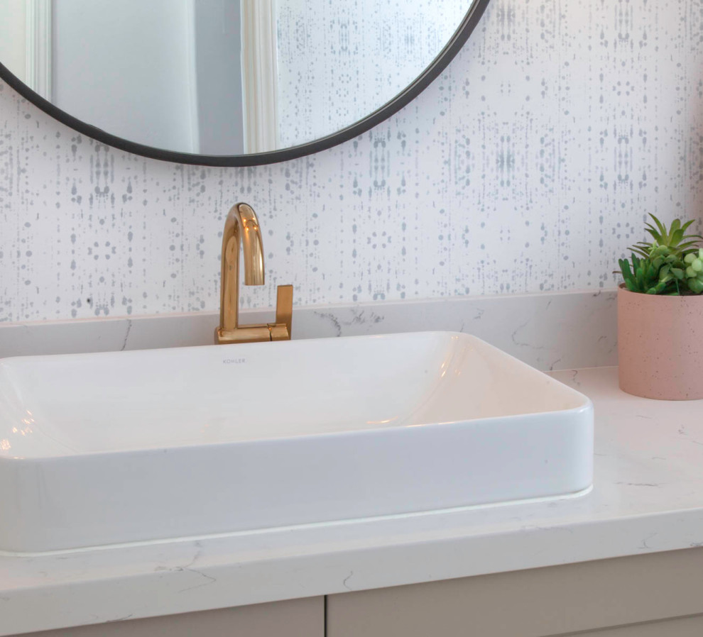 This is an example of a small beach style cloakroom in Denver with recessed-panel cabinets, beige cabinets, a one-piece toilet, white walls, marble flooring, a vessel sink, engineered stone worktops, white floors and white worktops.