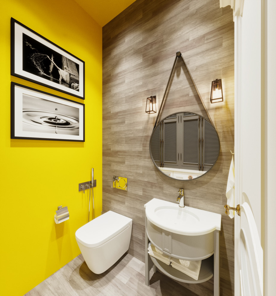 На фото: туалет в современном стиле с фасадами островного типа, белыми фасадами, инсталляцией, серой плиткой, желтыми стенами, врезной раковиной, серым полом, белой столешницей и акцентной стеной