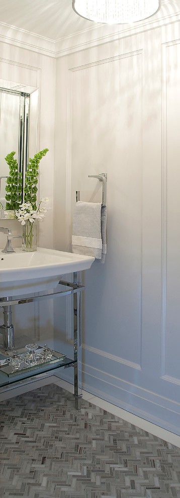 This is an example of a small traditional cloakroom in Toronto with a one-piece toilet, mosaic tiles, marble flooring, freestanding cabinets, white walls, an integrated sink and grey floors.