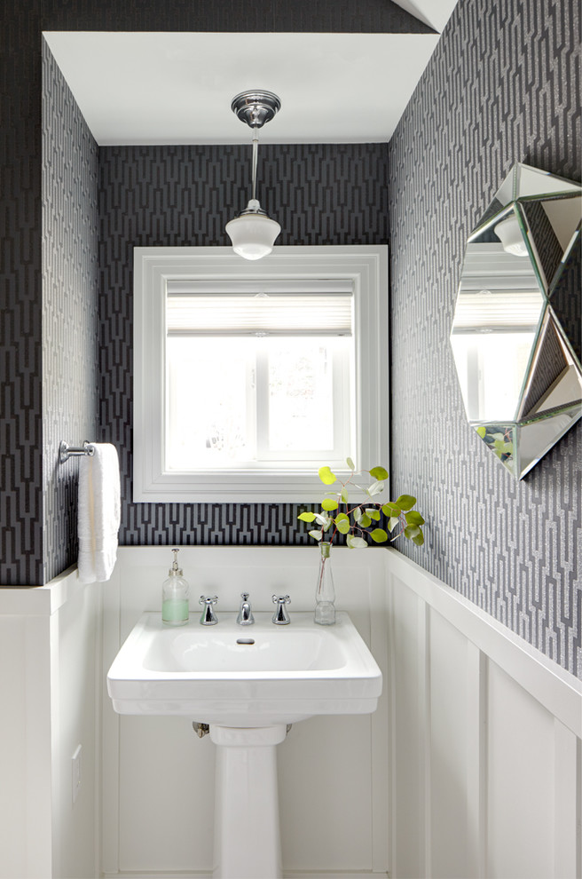 Example of a small classic powder room design in Seattle with a pedestal sink and multicolored walls