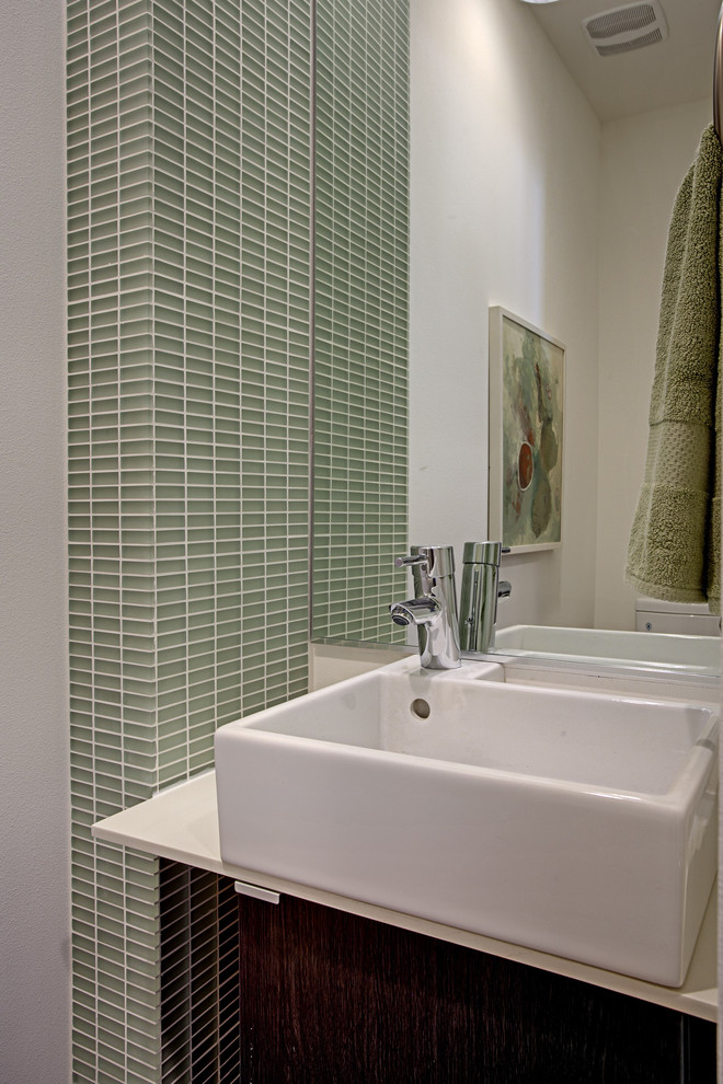 Example of a minimalist powder room design in Seattle with a vessel sink and white countertops