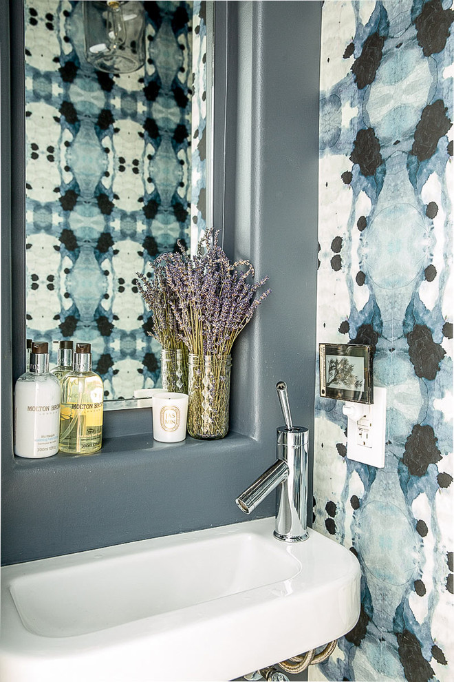 Inspiration for a contemporary powder room remodel in San Francisco with a wall-mount sink and multicolored walls