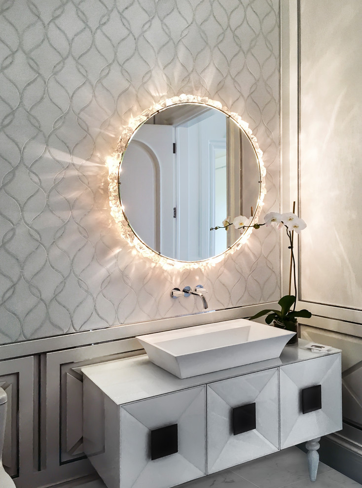 This is an example of a medium sized contemporary cloakroom in Miami with freestanding cabinets, multi-coloured walls, a vessel sink, white cabinets, marble flooring and grey floors.