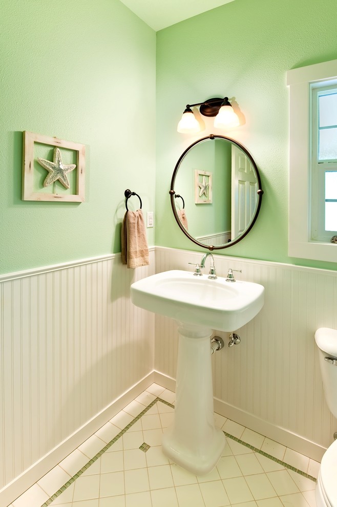 Powder room - small traditional white tile porcelain tile powder room idea in Portland with a pedestal sink and green walls