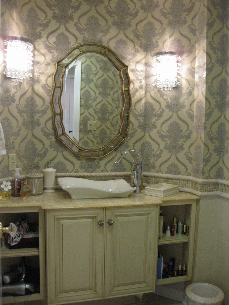 Example of a mid-sized eclectic beige tile, white tile and mosaic tile dark wood floor powder room design in Philadelphia with raised-panel cabinets, white cabinets, a one-piece toilet, beige walls, a vessel sink and solid surface countertops