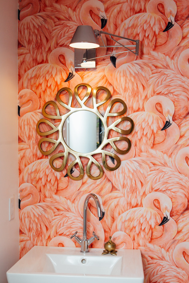 Small retro cloakroom in Denver with pink walls and a pedestal sink.