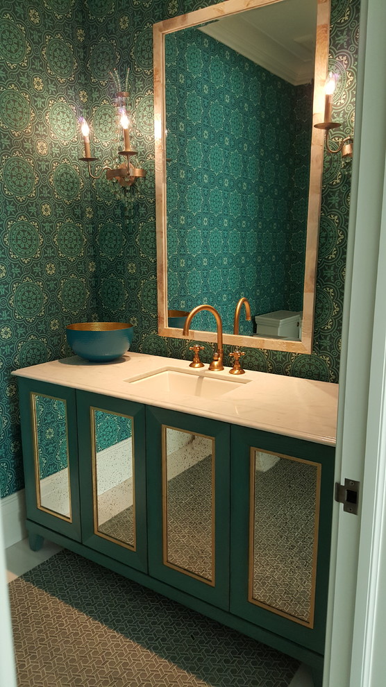 Inspiration for a coastal powder room remodel in Miami with glass-front cabinets