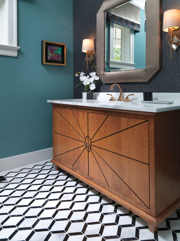Example of a mid-sized 1950s ceramic tile and multicolored floor powder room design in Chicago with furniture-like cabinets, medium tone wood cabinets, multicolored walls, an undermount sink, marble countertops and white countertops