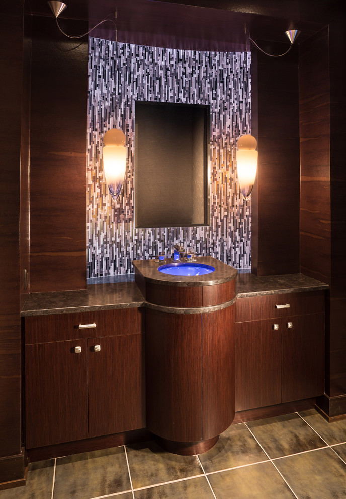 Powder room - huge modern matchstick tile limestone floor powder room idea in Milwaukee with an undermount sink, dark wood cabinets, granite countertops and a one-piece toilet