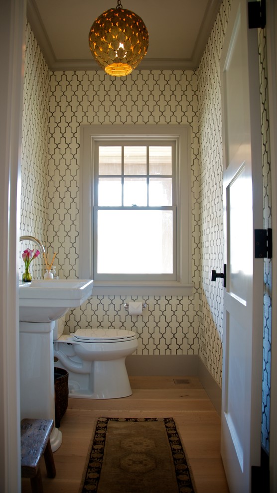Ornate powder room photo in Boston with a pedestal sink