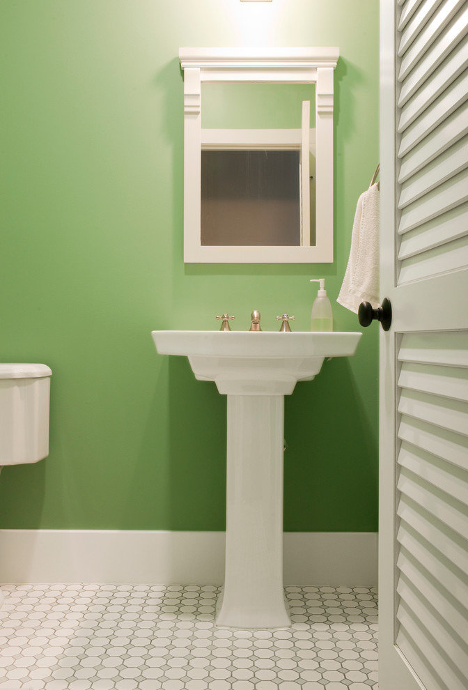 Example of a mid-sized trendy white tile porcelain tile powder room design in Hawaii with green walls
