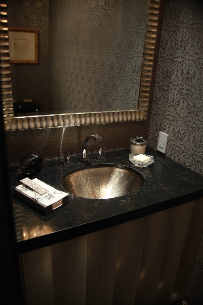 Example of a trendy dark wood floor powder room design in Los Angeles with a drop-in sink, quartz countertops, a two-piece toilet and gray walls