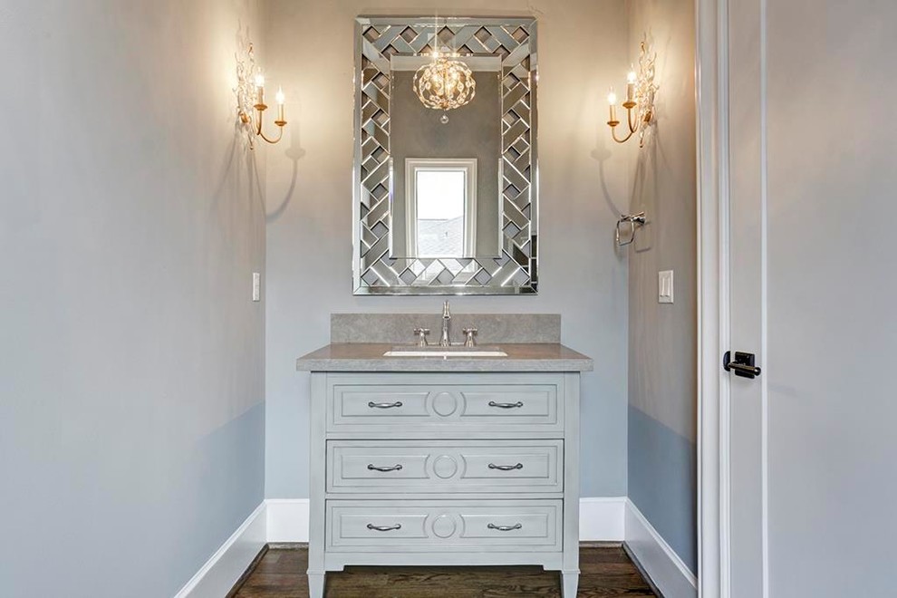 Inspiration for a large classic cloakroom in Houston with freestanding cabinets, grey cabinets, grey walls, medium hardwood flooring, a submerged sink, quartz worktops, brown floors and grey worktops.