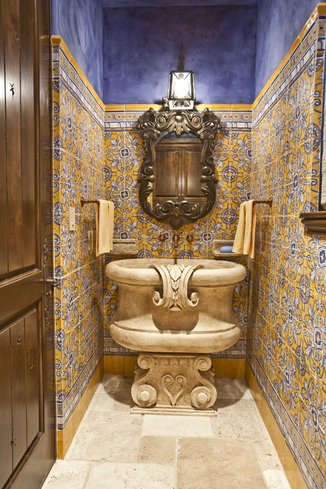 Design ideas for a mediterranean cloakroom in Houston with a pedestal sink, multi-coloured tiles and feature lighting.
