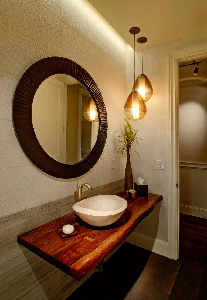 Photo of a small classic cloakroom in Seattle with a vessel sink, wooden worktops, beige tiles, stone tiles, beige walls, limestone flooring and brown worktops.