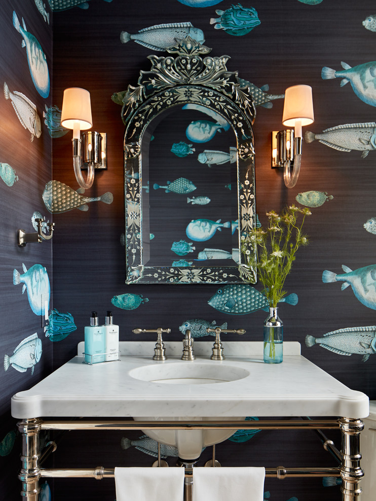 Example of a mid-sized beach style powder room design in Chicago with open cabinets, white cabinets, blue walls, an undermount sink and marble countertops