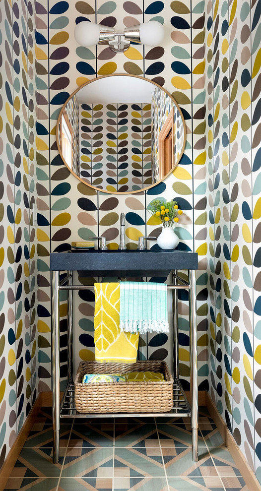 Powder room - eclectic multicolored floor powder room idea in Minneapolis with multicolored walls and black countertops