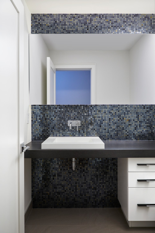 Contemporary Powder Room with Glass Mosaic Tile Backsplash