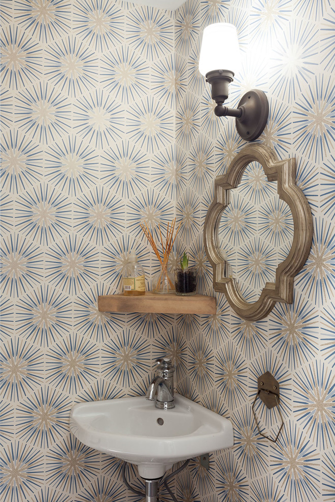 Small midcentury cloakroom in DC Metro with a two-piece toilet, multi-coloured walls, a wall-mounted sink, white worktops, mosaic tile flooring, blue floors, feature lighting and wallpapered walls.